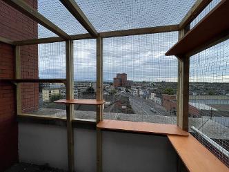 Apartment Balcony enclosed in mesh panels to make it safe for pets
